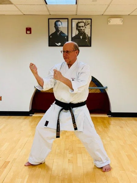 Allan Azoff demonstrating a karate stance at the dojo
