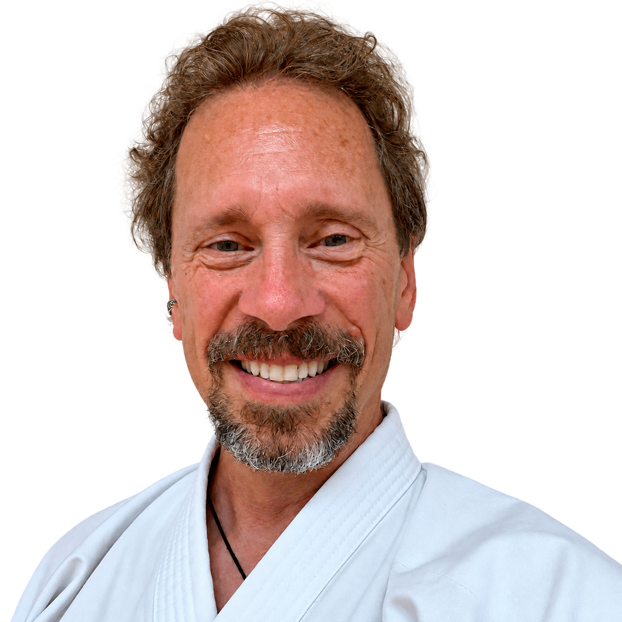 Bruce Randall smiling in a karate uniform