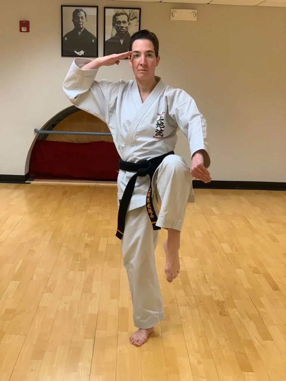 Jen Patashnick practicing a martial arts stance in the dojo