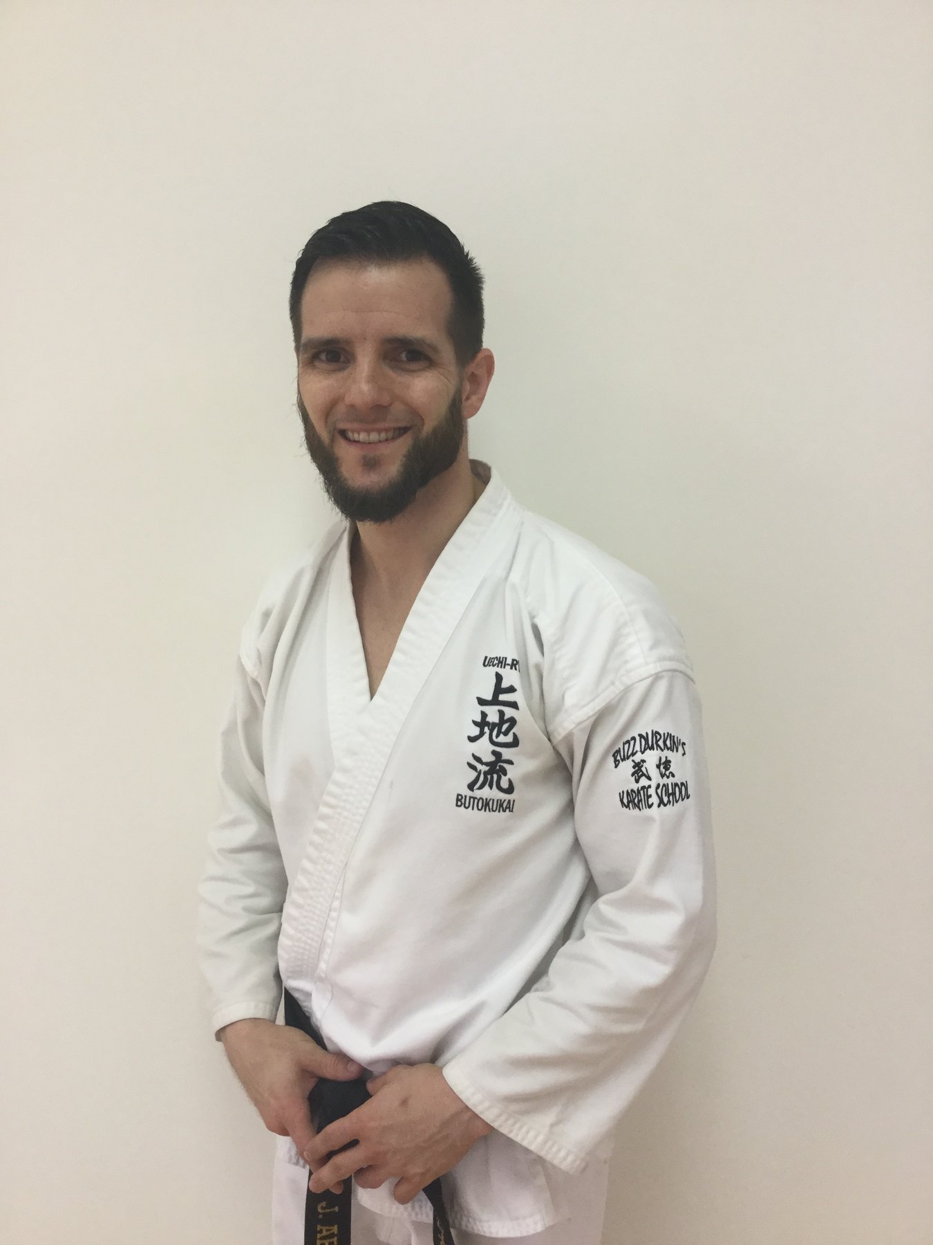 Josiah Armstrong standing in a karate uniform