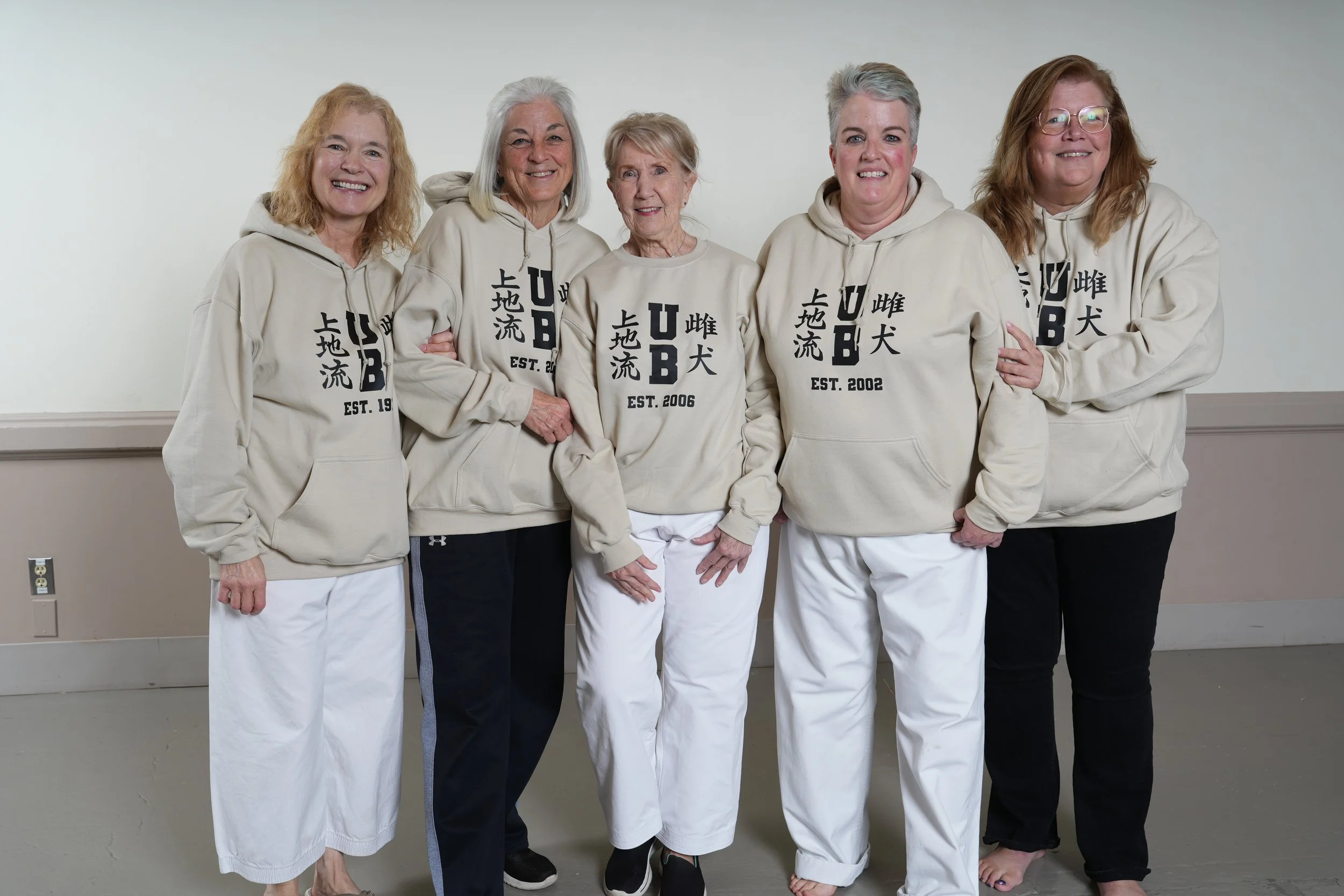 Judy Durkin, at left, with fellow martial artists at the school’s anniversary gathering