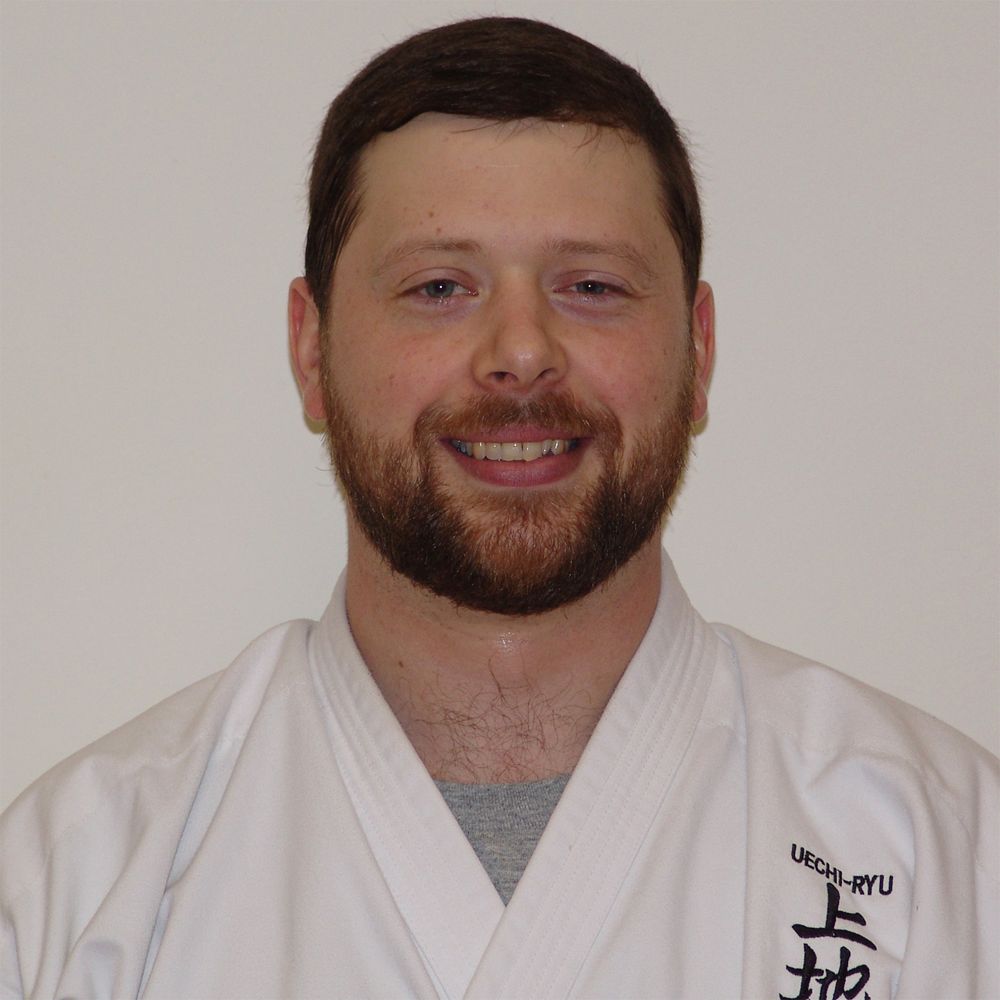 Christopher Adams in a karate uniform