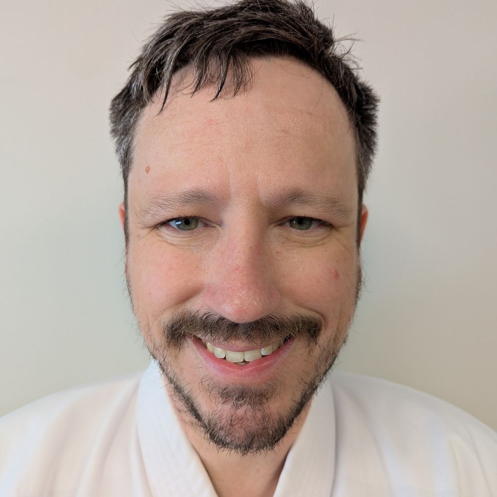 John Guilmartin in a karate uniform