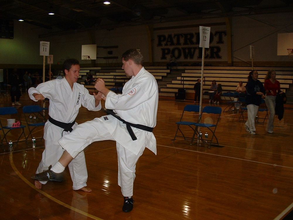 John Guilmartin practicing karate at an event