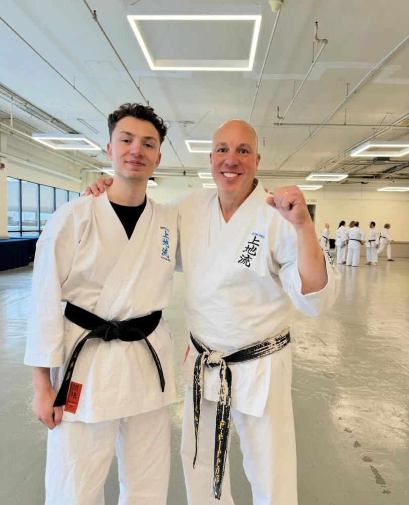 Peter Pippos with a fellow karate practitioner