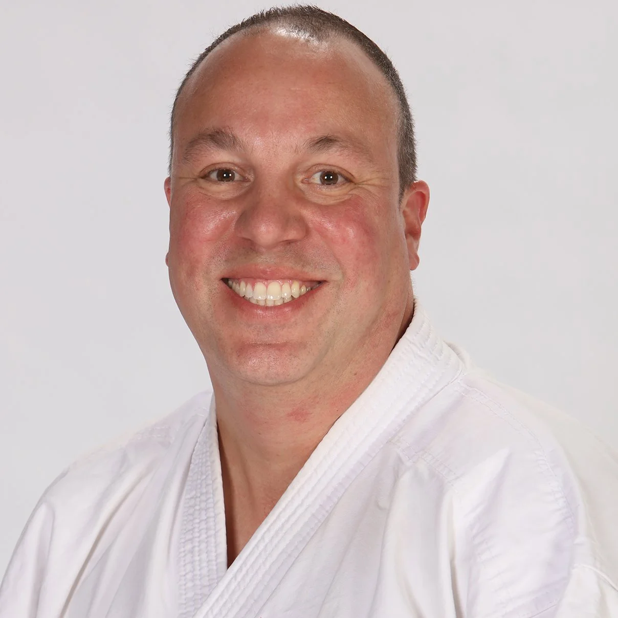 Peter Pippos in a karate uniform