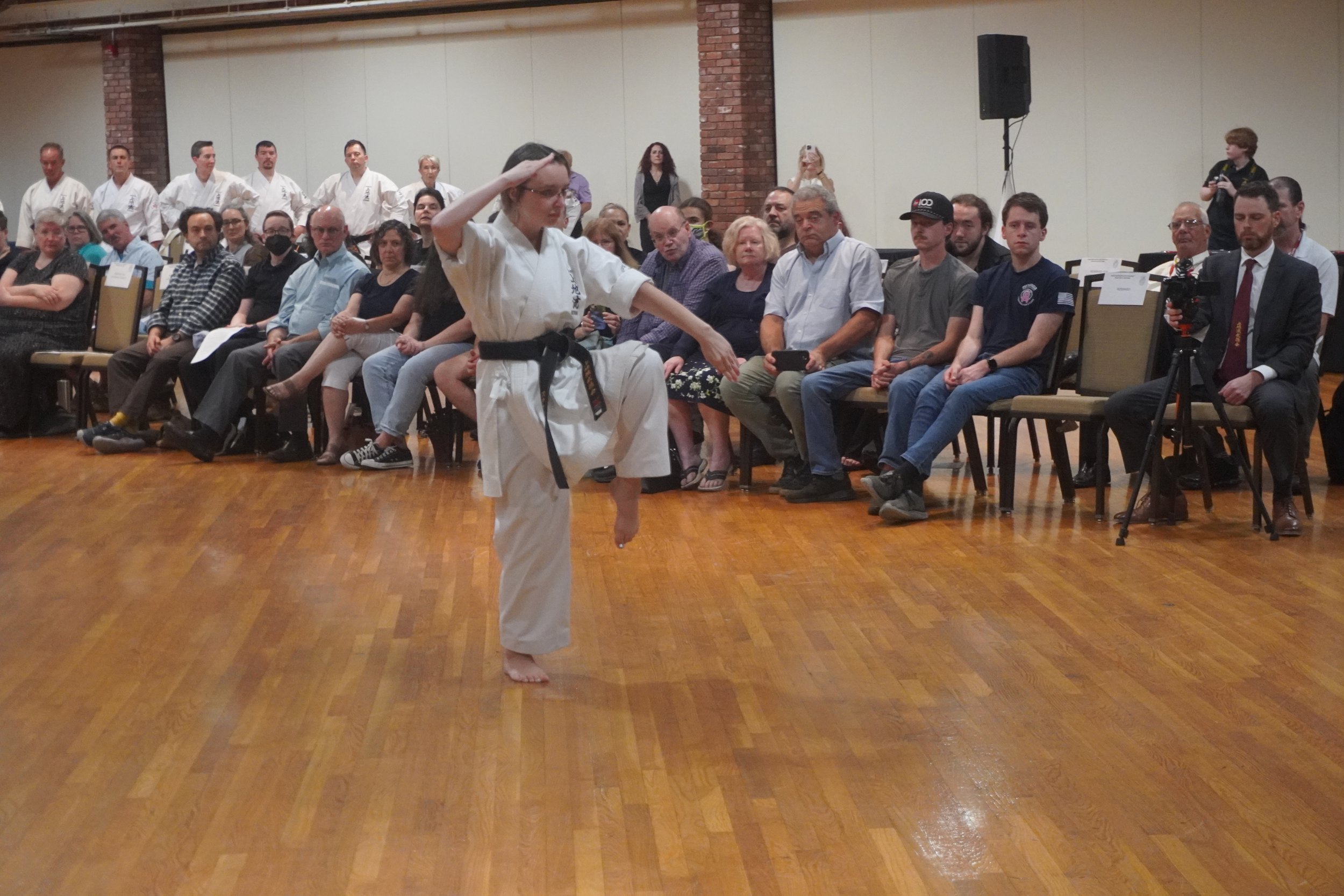Stephanie Rodenhiser demonstrating karate in front of an audience
