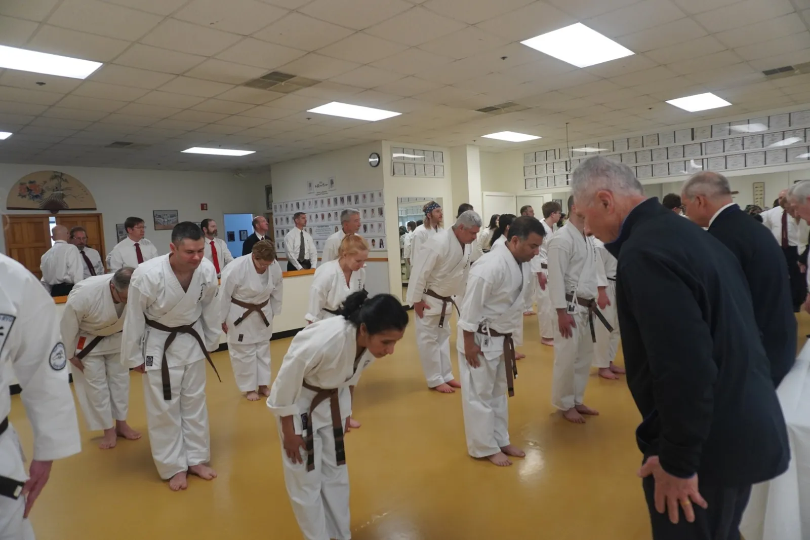 Candidates and senior judges bowing to each other