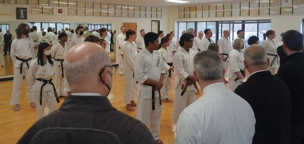 Senior black belt candidates assembled before a panel of judges
