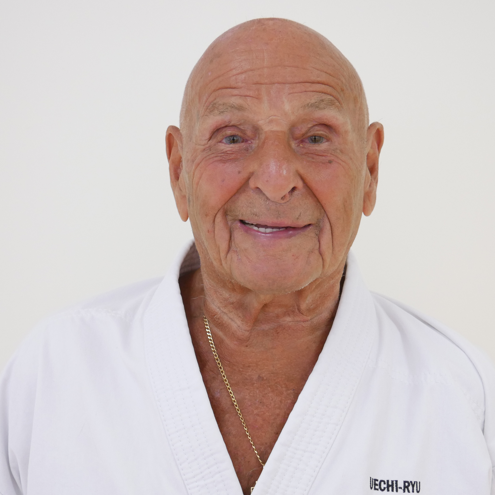 Warren Chaille smiling in his karate uniform